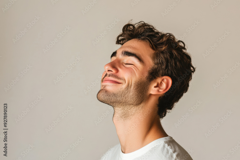 Obraz premium A close up of a man's face with his eyes closed