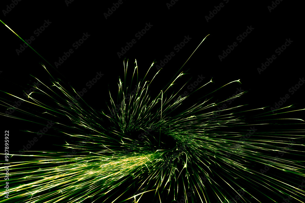 green sparks from the grinder glowing in the dark green sparks from the grinder glowing in the dark