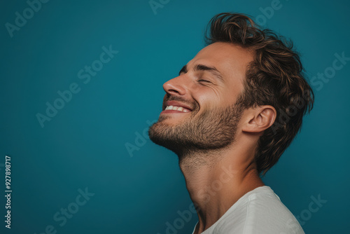 A close up of a man's face with his eyes closed