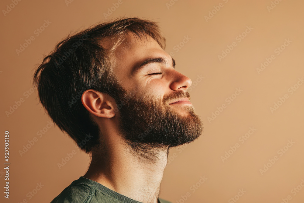 Obraz premium A close up of a man's face with his eyes closed