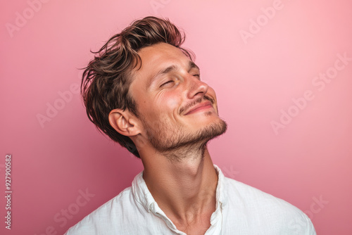 A close up of a man's face with his eyes closed