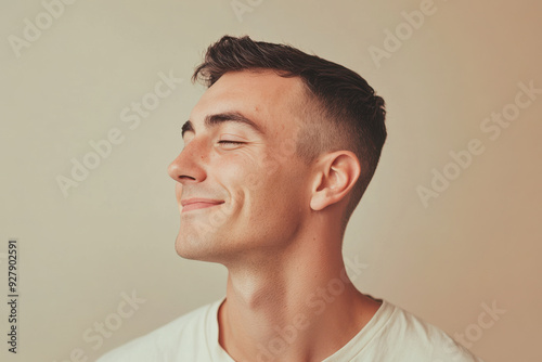 A close up of a man's face with his eyes closed