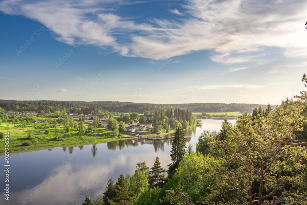 A beautiful view of a river with a town in the background A beautiful view of a river with a town in the background
