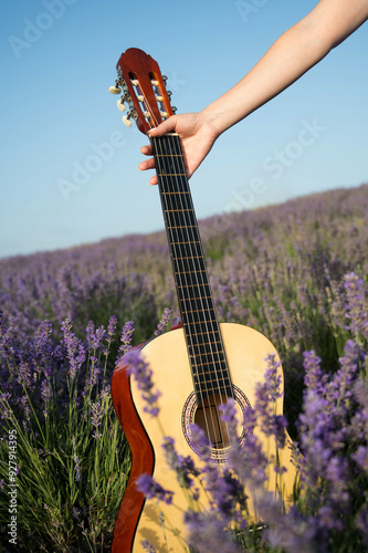 Acoustic guitar in a blooming lavender field