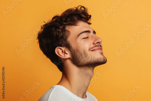 A close up of a man's face with her eyes closed