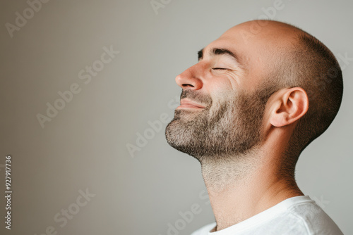 A close up of a man's face with his eyes closed