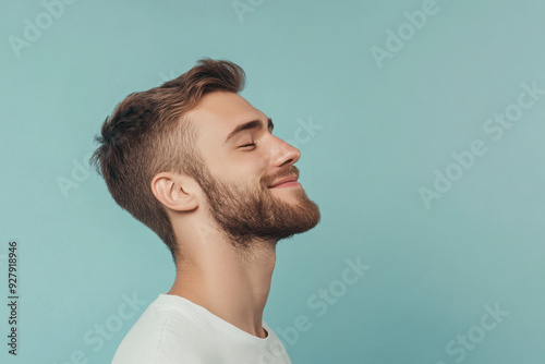 A close up of a man's face with his eyes closed