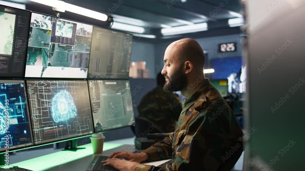 Army specialist employing AI tech to improve military warfare systems and threat monitoring. IT admin uses neural networks to enhance combat operational capabilities, camera B Army specialist employing AI tech to improve military warfare systems and threat monitoring. IT admin uses neural networks to enhance combat operational capabilities, camera B