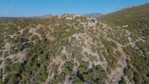 Aerial view of a white hill containing naturally occurring asbestos photo