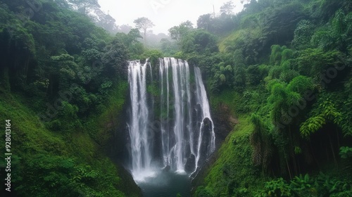 Majestic Waterfall Surrounded by Lush Greenery