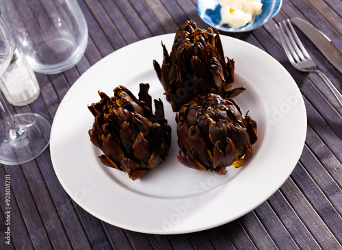 Popular Mediterranean dish is baked artichokes. Close-up image photo