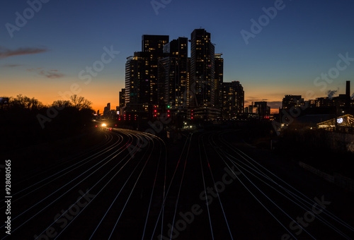  Downtown city at night. Sunset in financial district. railway interchange, condos, office buildings illuminated. skyline Toronto, Ontario, Canada