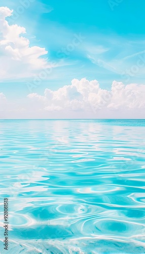 Blue freshwater lake with a reflection of a clear sky, perfect for peaceful and meditative visuals