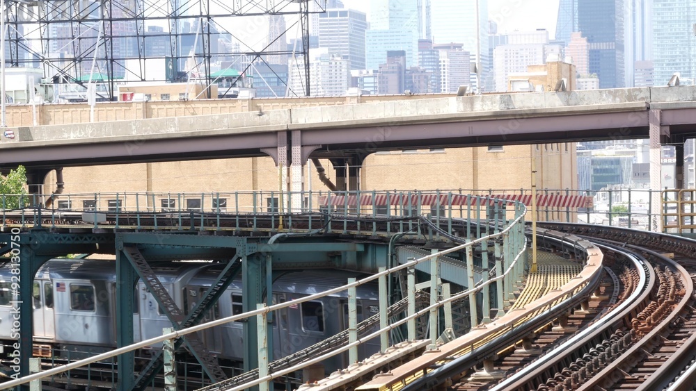 New York subway station. Metro train on metropolitan platform. United States public transportation. Elevated Queensboro Plaza railway line, Queens. NYC Manhattan skyline, highrise skyscraper cityscape
