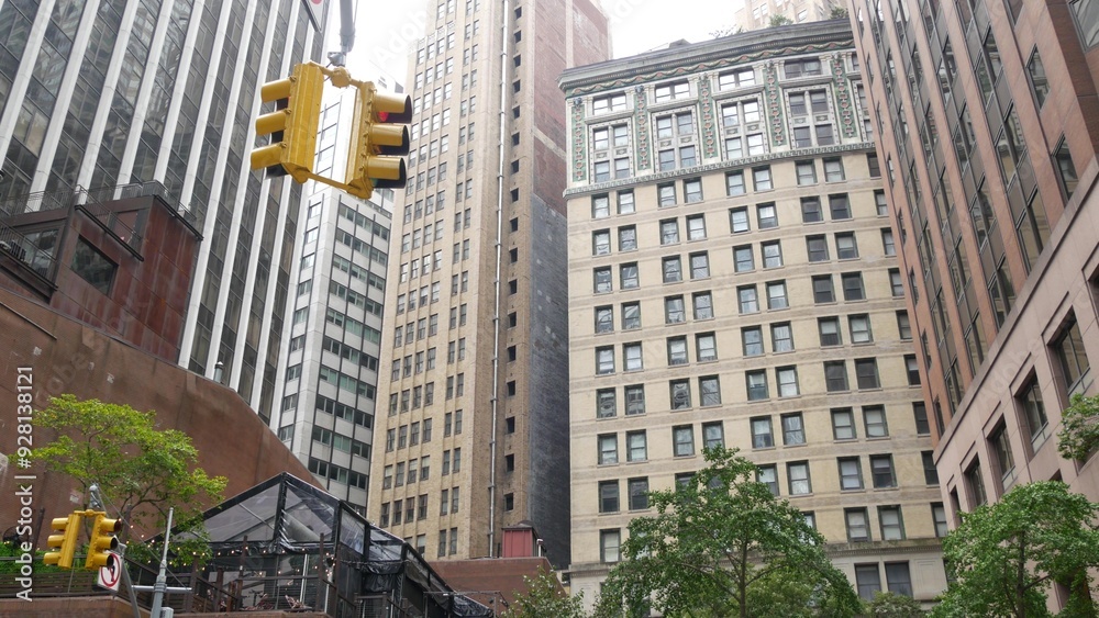 Fototapeta premium New York City Water street crossroad, yellow traffic light, transport road intersection, United States. NYC Lower Manhattan, downtown financial business district. Highrise skyscrapers. Gouverneur Ln.