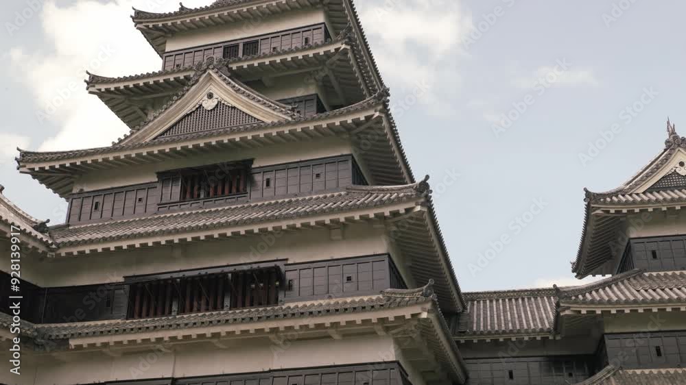 Slow pan up for close up of outer walls of matsumoto castle Slow pan up for close up of outer walls of matsumoto castle