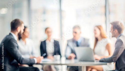 Conference Table Soft Blur - Blurred view of a conference table with abstract shapes and colors.
