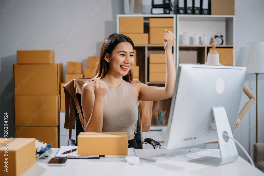 Asian woman prepares parcels and checks online orders on tablet and laptop for delivery online shopping and small business success Asian woman prepares parcels and checks online orders on tablet and laptop for delivery online shopping and small business success
