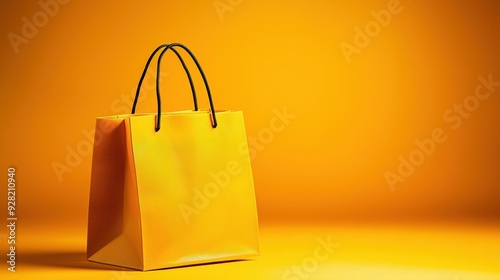 A vibrant yellow shopping bag on a solid yellow background, perfect for showcasing retail or shopping concepts.