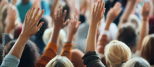 A Crowd of Hands Raised in Unison