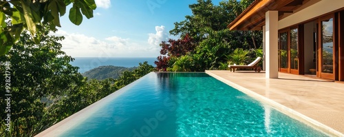 Luxurious villa with an infinity pool overlooking a serene coastal landscape, perfect for relaxation and rejuvenation. photo