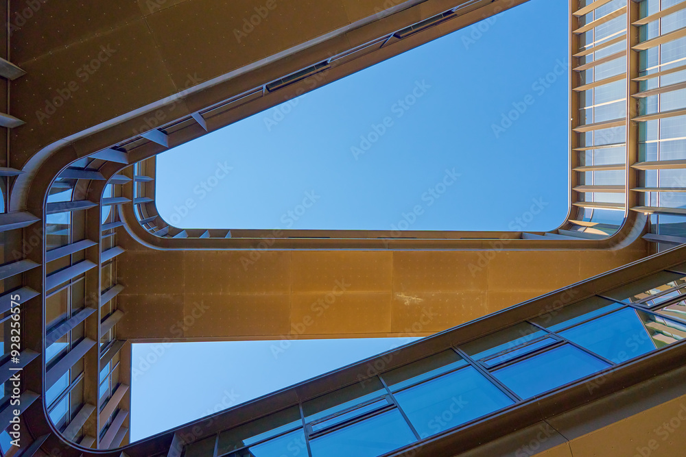 Geometric composition with architectural elements. Exterior of modern building against blue sky. Minimalistic street architecture