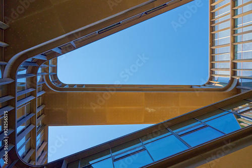 Obraz na płótnie Geometric composition with architectural elements. Exterior of modern building against blue sky. Minimalistic street architecture w salonie