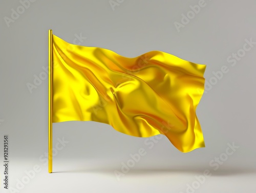 A yellow flag is waving in the wind on a gray background