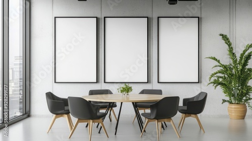 Fototapeta Naklejka Na Ścianę i Meble -  A large conference room with a white wall and three black framed pictures