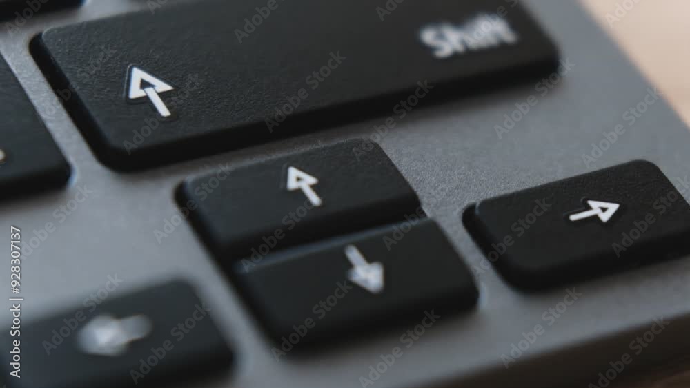 A detailed look at arrow keys on a keyboard, illustrating their function for moving up, down, left, and right during navigation. A detailed look at arrow keys on a keyboard, illustrating their function for moving up, down, left, and right during navigation.