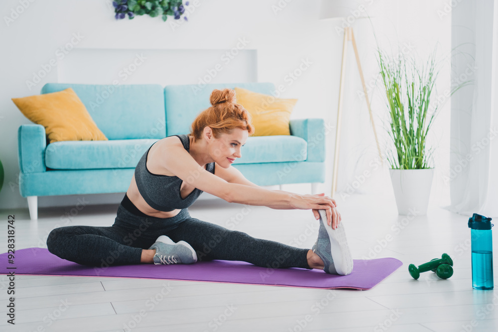 Photo of attractive motivated woman wearing activewear doing physical exercises warm up daylight indoors Photo of attractive motivated woman wearing activewear doing physical exercises warm up daylight indoors