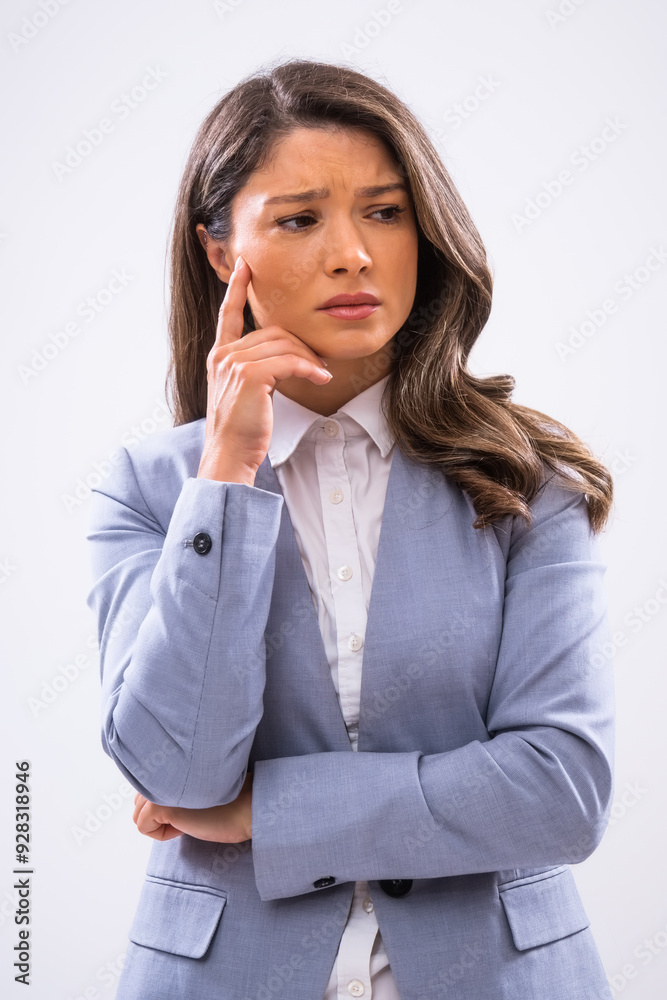 Portrait of worried businesswoman who is looking away and thinking. Portrait of worried businesswoman who is looking away and thinking.