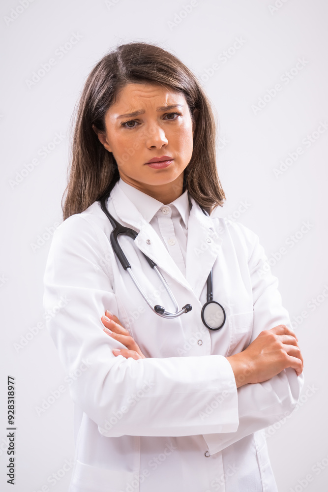 Portrait of female doctor who is tired and overworked. Portrait of female doctor who is tired and overworked.