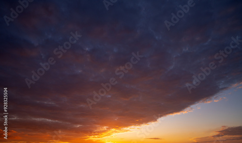 Dramatic Colorful Sunset Sky. Clouds with Sunrays. Cloudscape Sunset Background. Panorama Sky. Dramatic sky with clouds at sunset or sunrise. Sunset Sundown. Sky with colorful clouds.