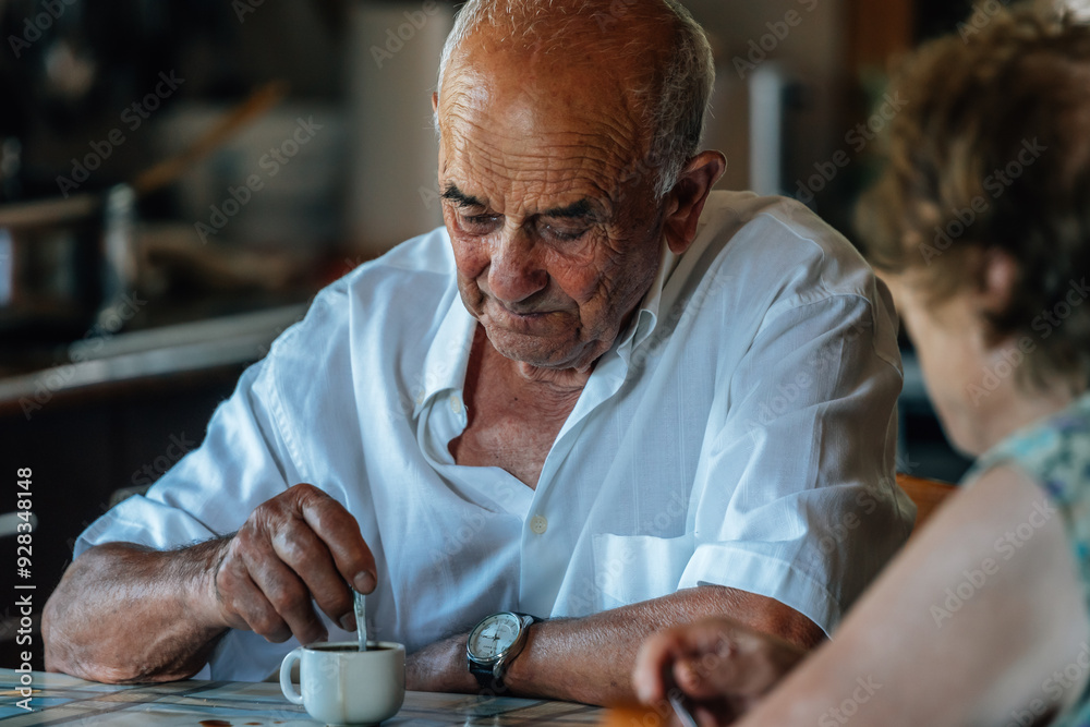 Family life of a senior couple at home drinking coffee Family life of a senior couple at home drinking coffee