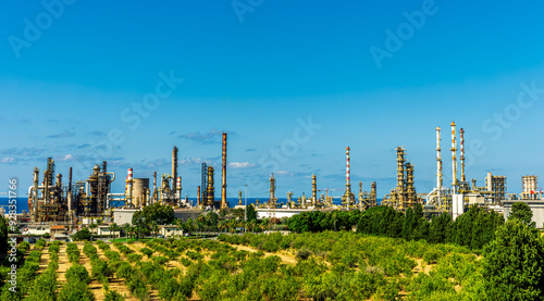 oil refinery facroty, recycle of oil and petroleum in green outdoor nature photo