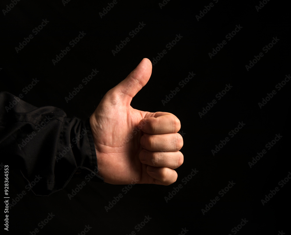 man's hand showing thumbs up. Background. Man hand. man's hand showing thumbs up. Background. Man hand.