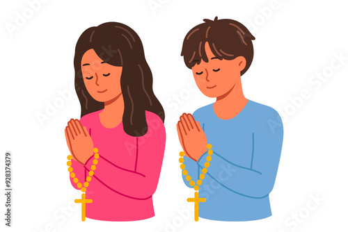 Christian children pray holding rosary with religious crosses and turning to god. Christian boy and girl from elementary school, demonstrating peace and humility before lord from bible