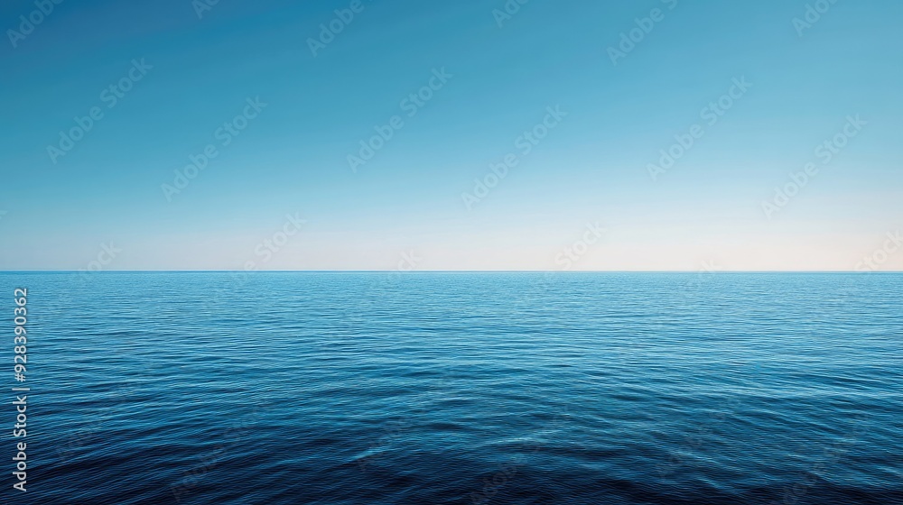 A panoramic shot of a blue sea with a distant horizon and a cloudless sky. A panoramic shot of a blue sea with a distant horizon and a cloudless sky.