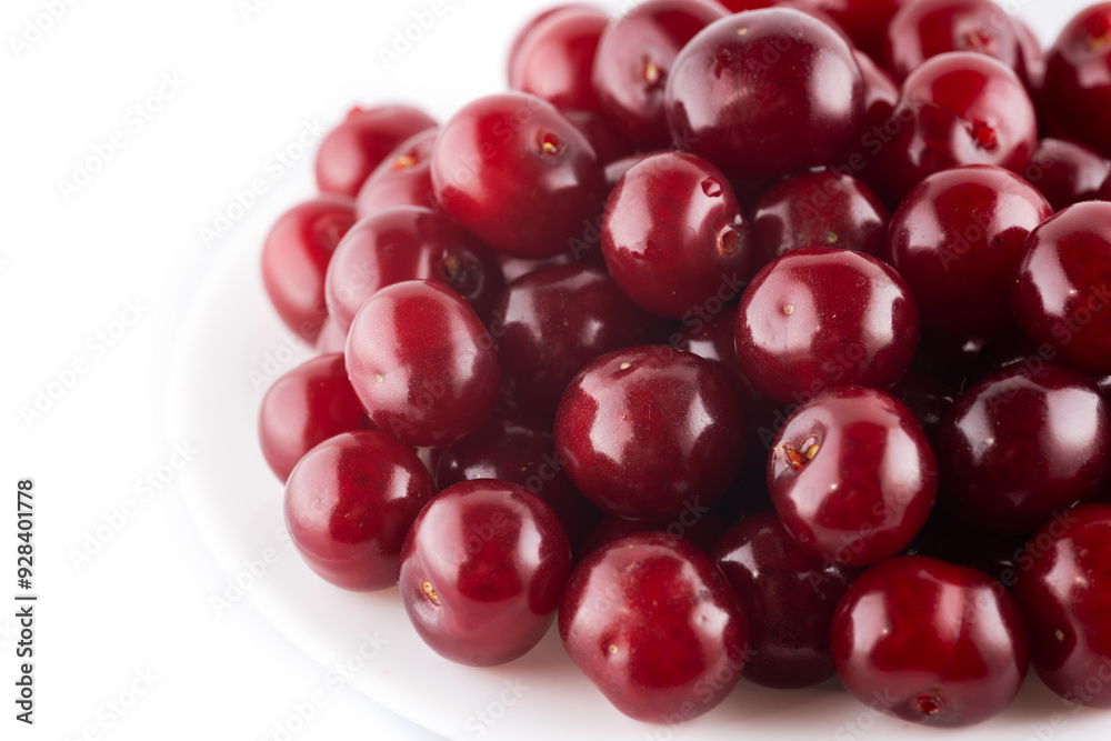Ripe red cherries on plate isolated on white background Ripe red cherries on plate isolated on white background