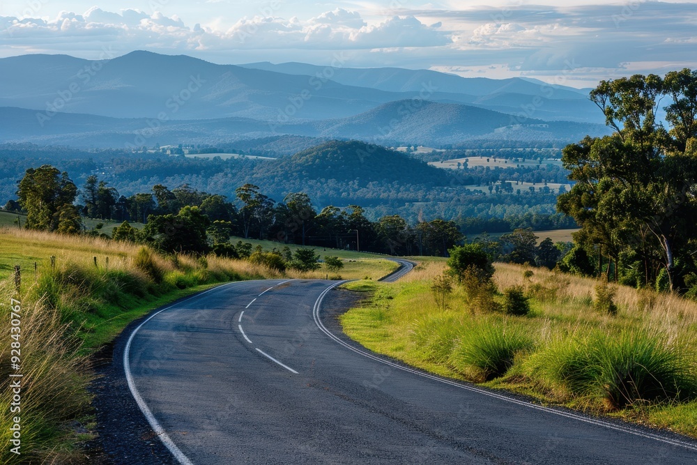 Fototapeta premium Scenic road with curve and mountains ahead