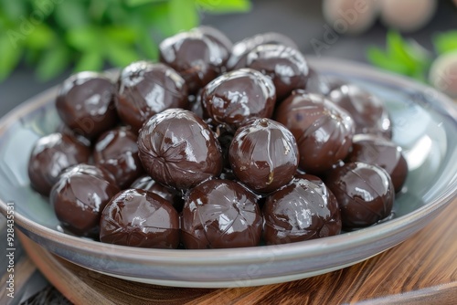 Tasty water chestnuts on a plate at the table photo