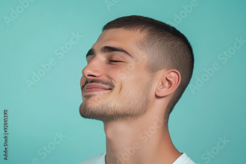 A close up of a man's face with his eyes closed