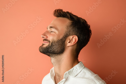 A close up of a man's face with his eyes closed