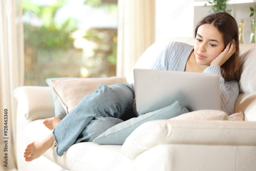 Portrait of a serious woman using laptop at home Portrait of a serious woman using laptop at home