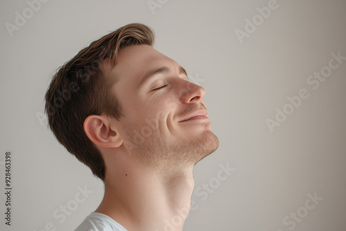 A close up of a man's face with his eyes closed