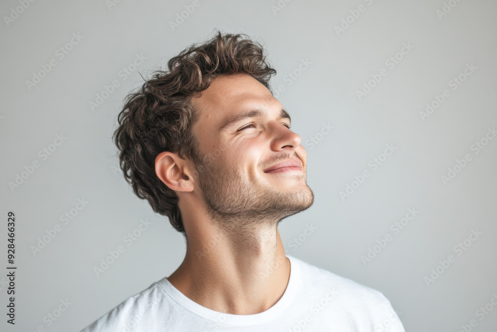 A close up of a man's face with his eyes closed