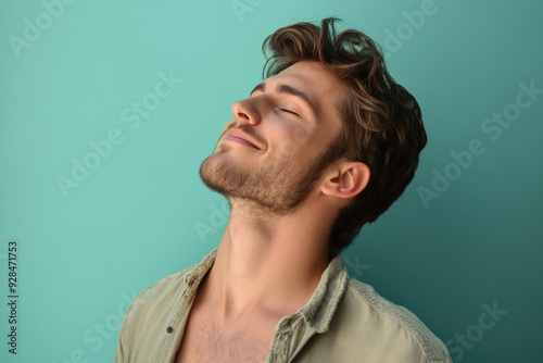 A close up of a man's face with his eyes closed