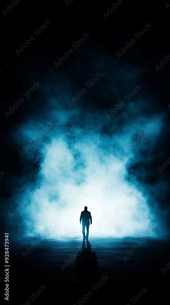 Fototapeta premium Man in Silhouette Walking into Dense Fog with Dramatic Lighting