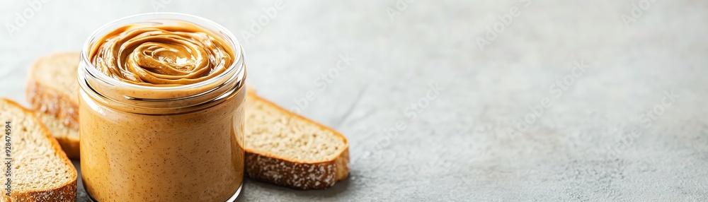 Organic nut butter, jar with spread on bread, 3D animation illustration Organic nut butter, jar with spread on bread, 3D animation illustration
